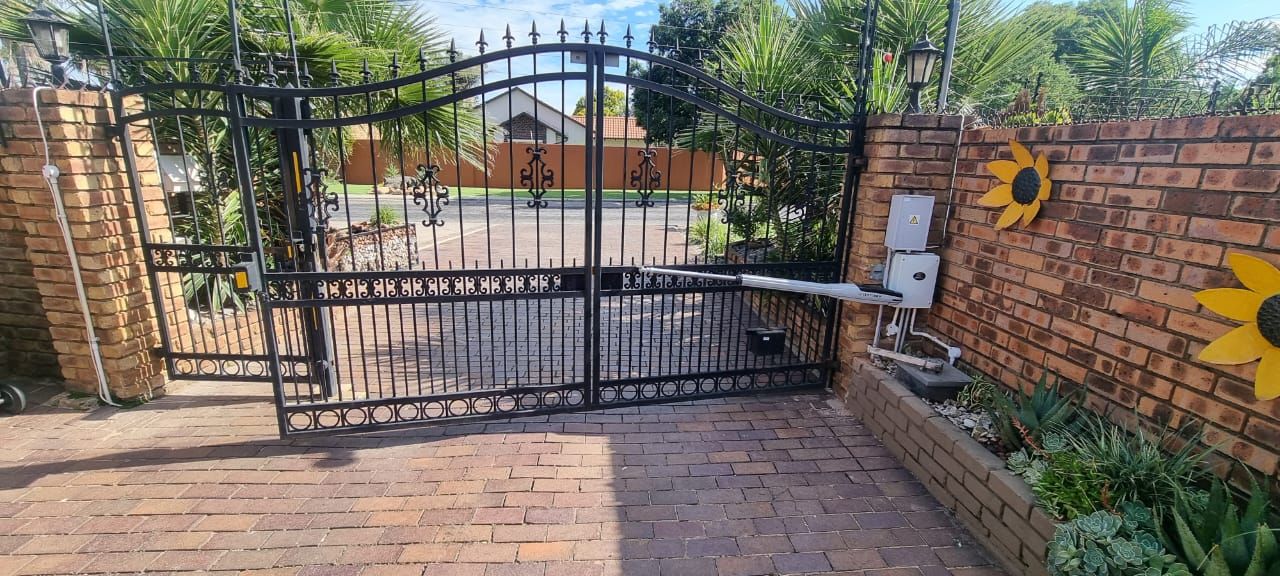 Finished wrought iron swing gate with motor installed